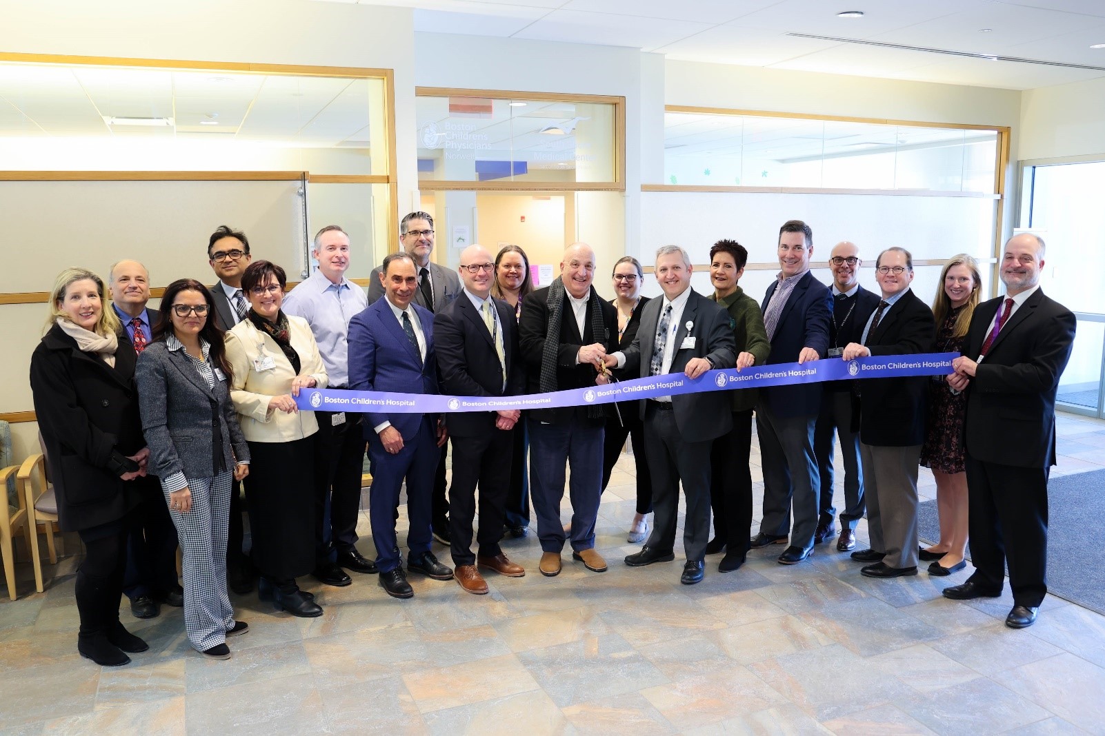Boston Children's Hospital and South Shore Health staff hold ribbon cutting at South Shore Medical Center Norwell