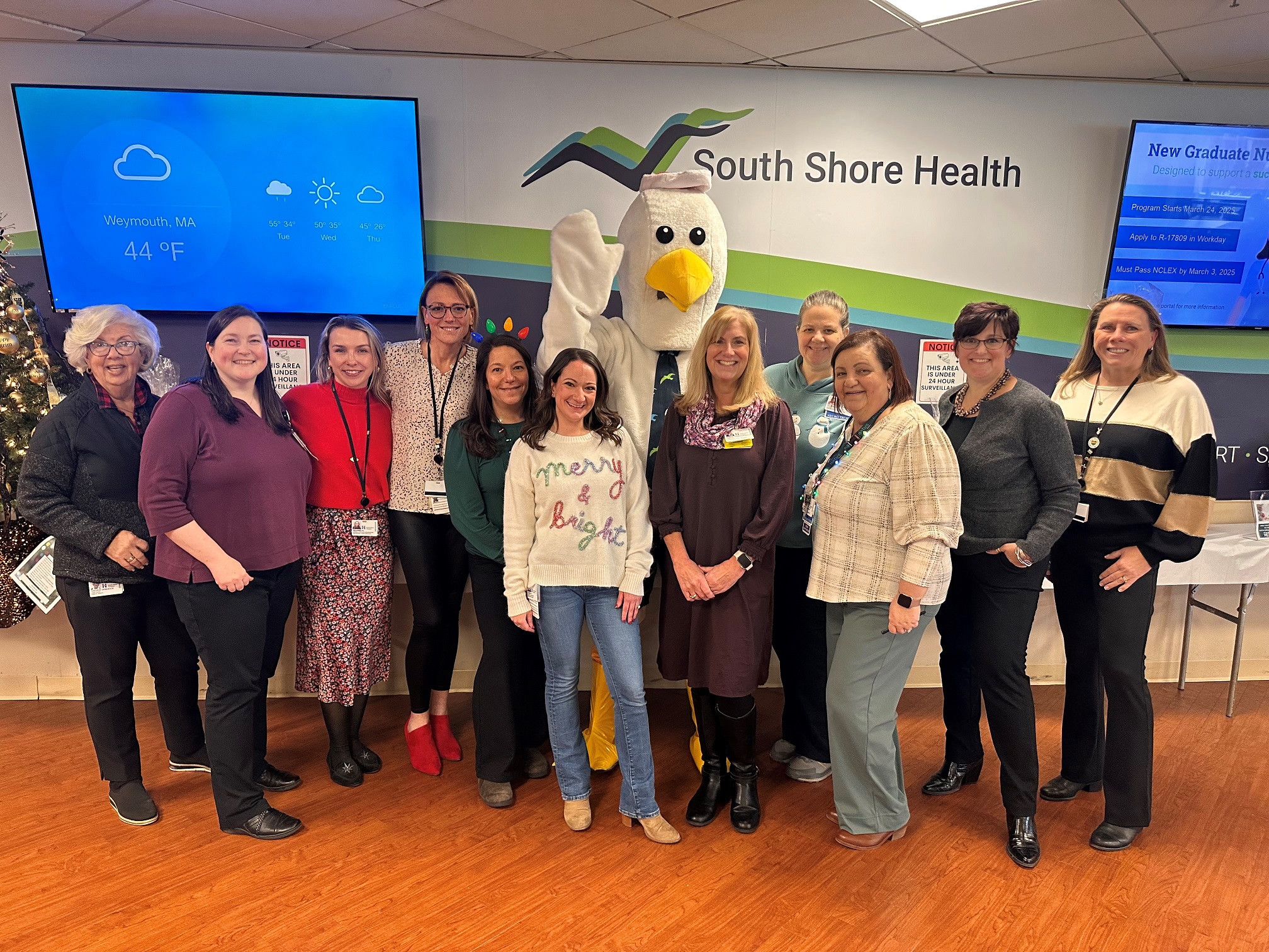 Members of the Generous Hearts committee pose for a photo after the 2024 holiday raffle.