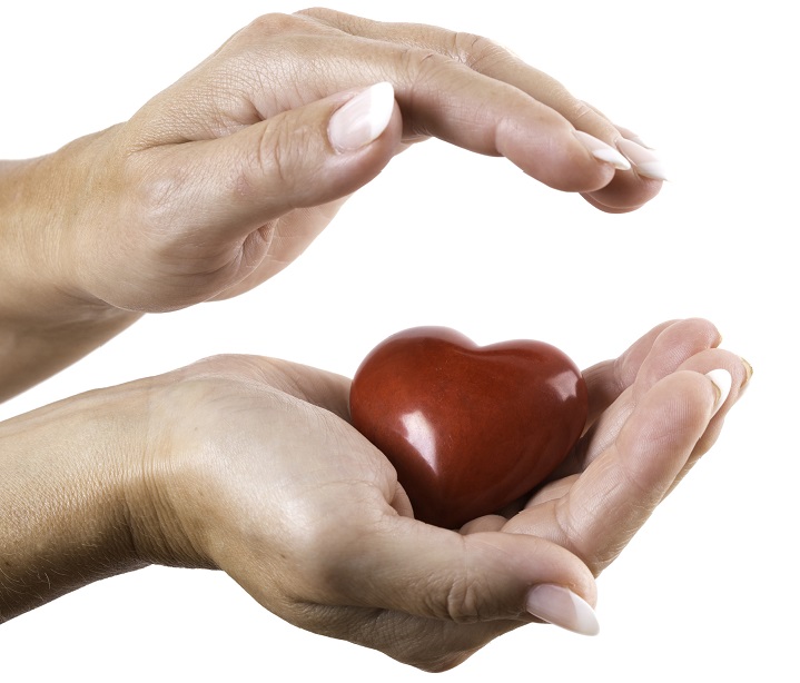 Woman's hands cupping a heart