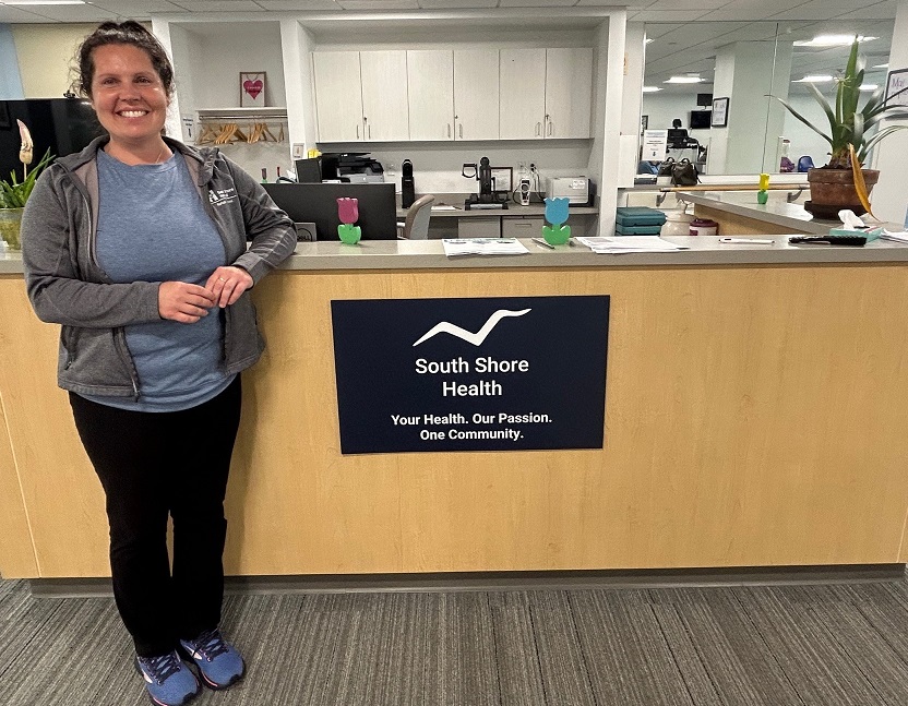 Jennifer Logan stands by the front desk at the Center for Physical Wellness