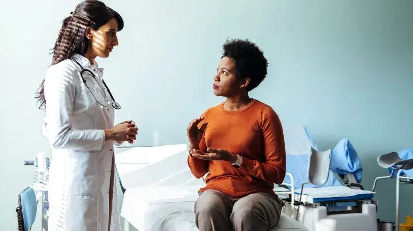 A female provider consults with a female patient