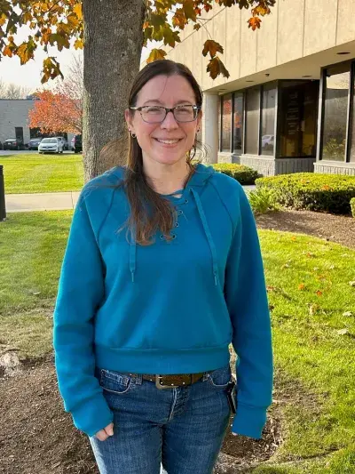 Home Care/VNA night nurse Jennifer Durant posing outside her office