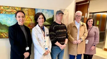 Colleagues from South Shore Health pose with members of the Kennefick family