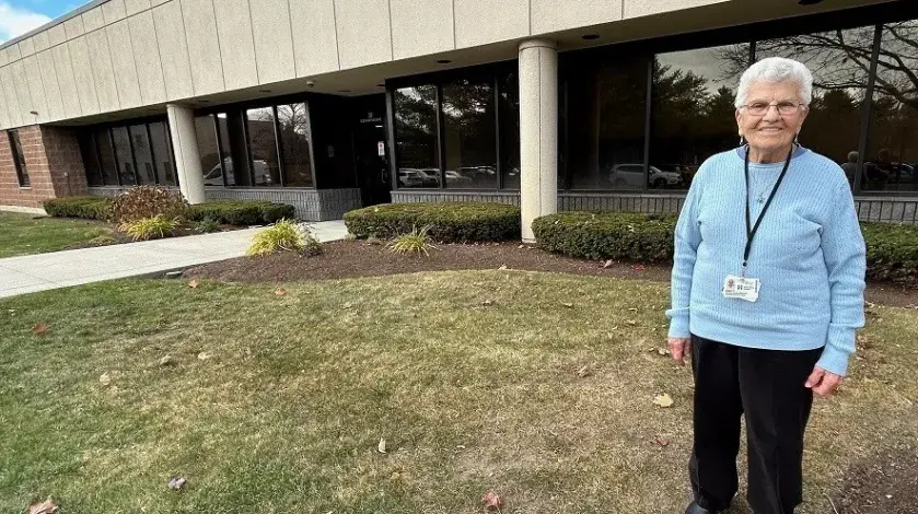 Mary Tosone stands outside the South Shore VNA office