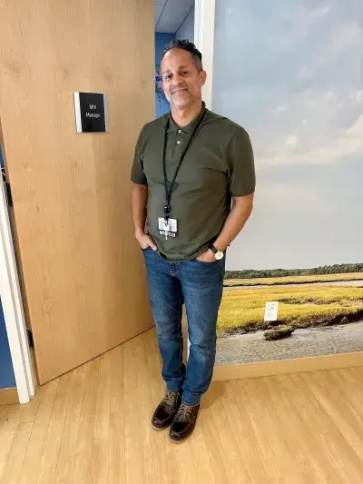 MRI manager Rafael Olmedo stands by the door to the imaging suite