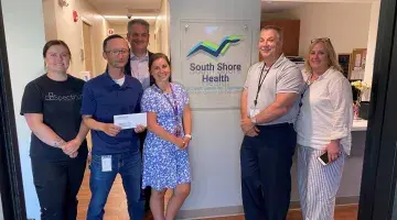Six members of South Shore Health and Spectrum Health Systems pose for a photo after Spectrum's recent grant.
